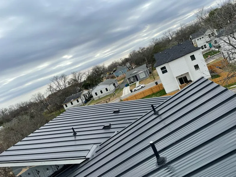 Standing seam metal roof panels with vents for Skylight Repair in Watertown